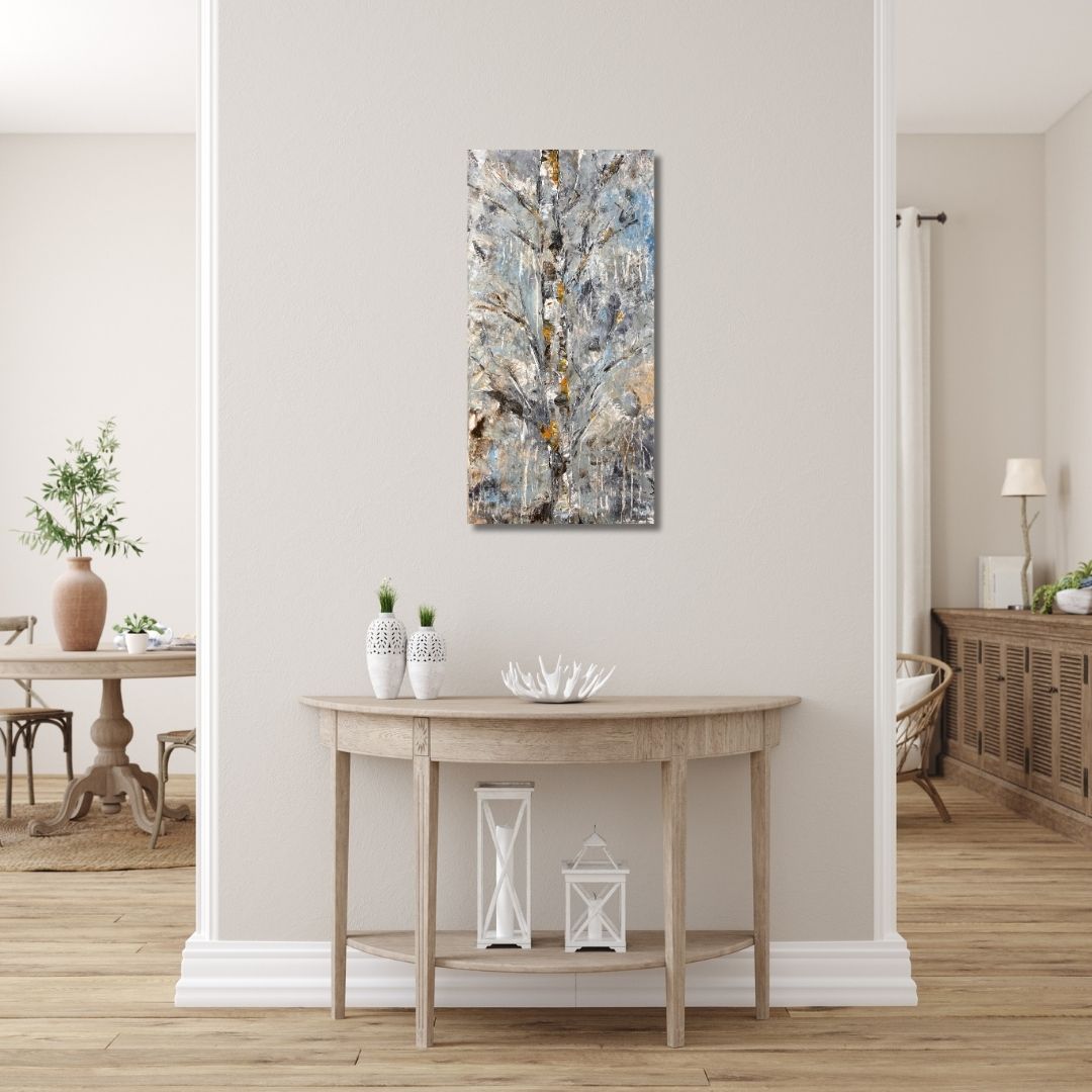 A textured abstract birch tree painting with cool greys and warm accents bY Ottawa artist Mireille Laroche in a modern setting.