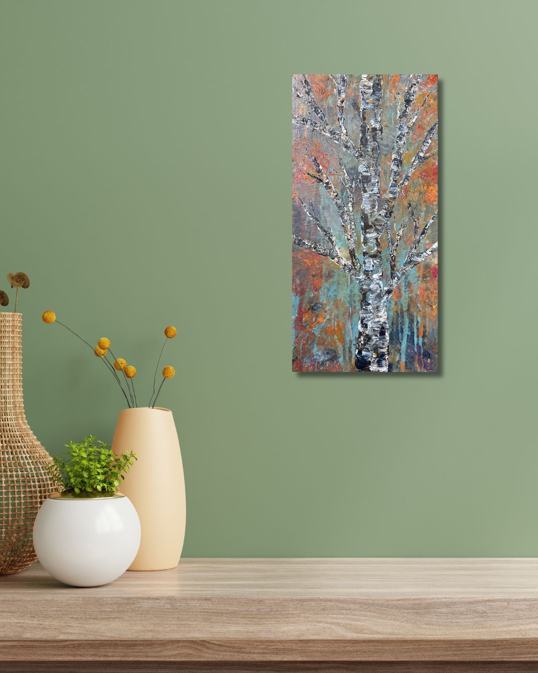 Abstract painting of a tree by Ottawa artist Mireille Laroche. Painting on a sage wall above a table with decorative vases.