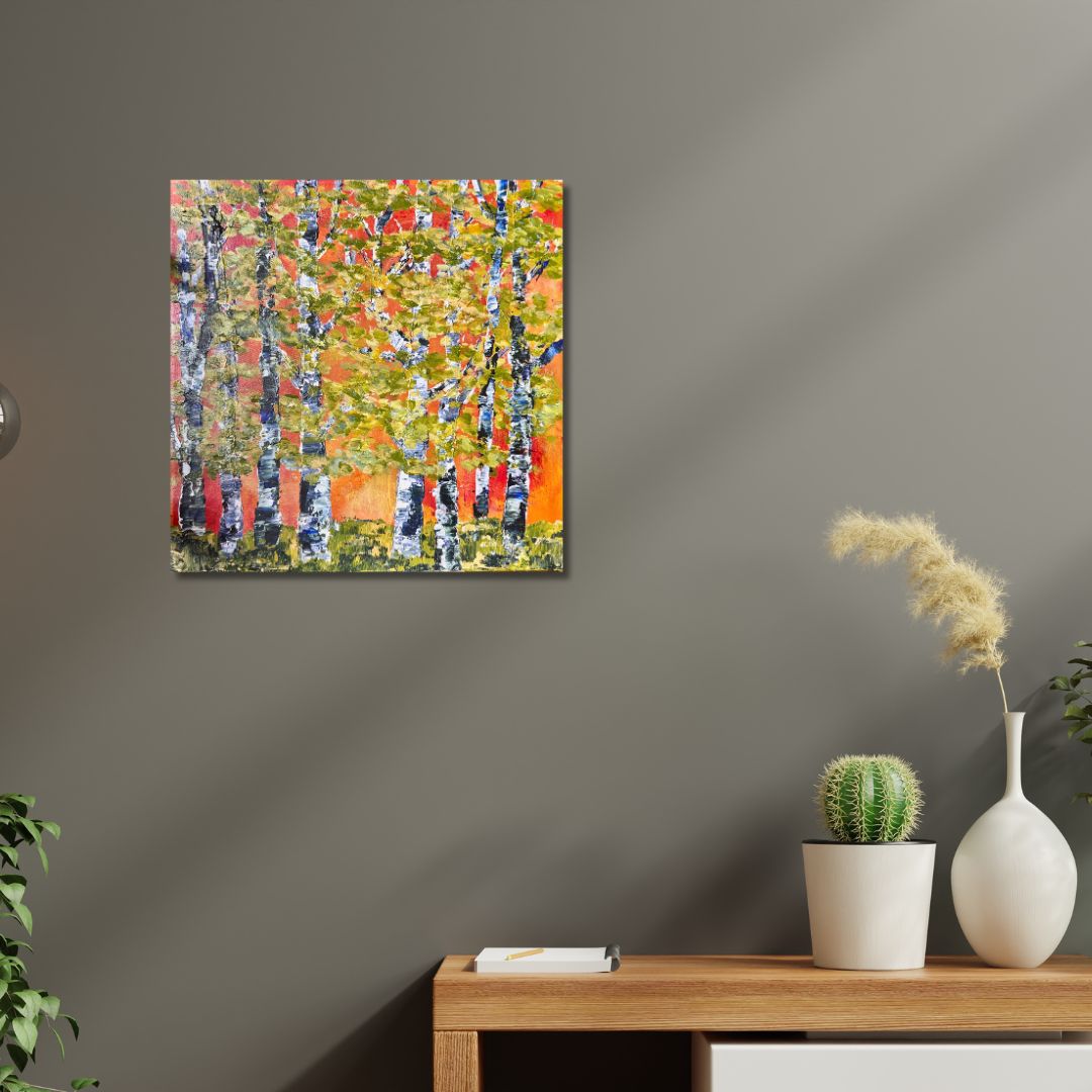 Abstract painting depicting trees by Ottawa-based artist Mireille Laroche on a wall above a wooden console table with decorative items