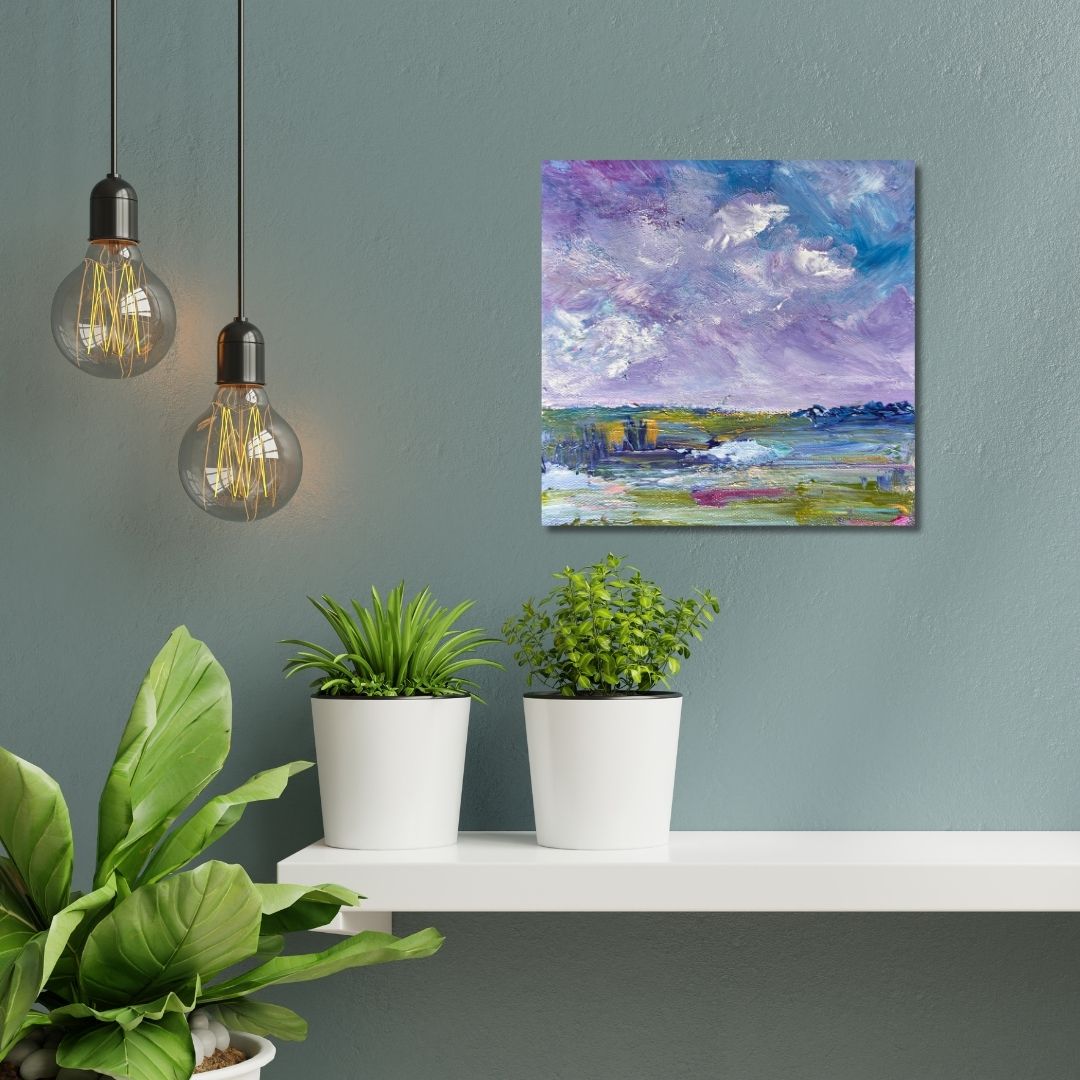 Colorful abstract painting by Ottawa artist Mireille Laroche on a gray wall.Modern interior with potted plants, and hanging light bulbs