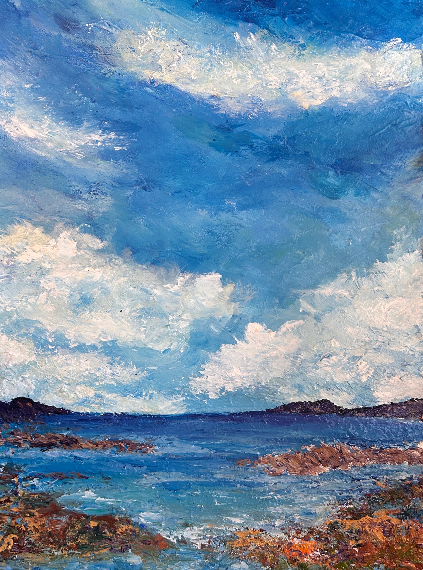 Original acrylic painting (18 by 24 inch) of a coastal scene with rocky shore and blue sky with clouds by Ottawa-based artist Mireille Laroche