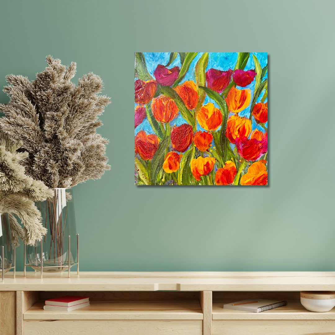 Original acrylic painting 12 by 12 inch on a 1.5 inch deep canvas by Ottawa-based artist Mireille Laroche. Colorful tulip painting on a wall above a wooden shelf with decorative items.