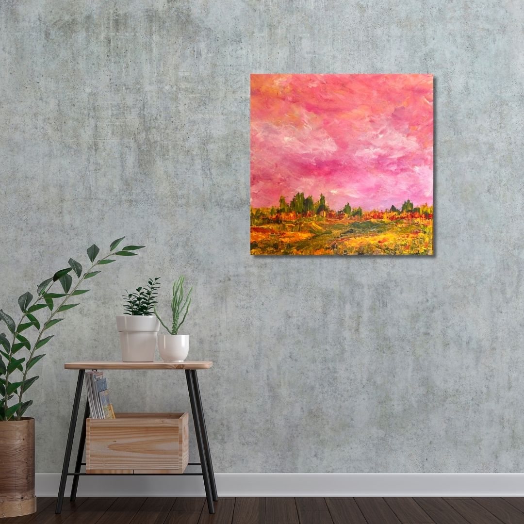 Colorful abstract painting by Ottawa artist Mireille Laroche on a textured wall above a wooden side table with plants.