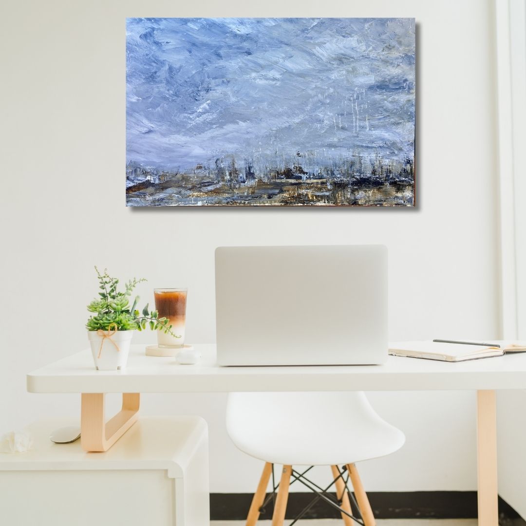 Abstract painting by Ottawa artist Mireille Laroche on a wall below a desk and computer
