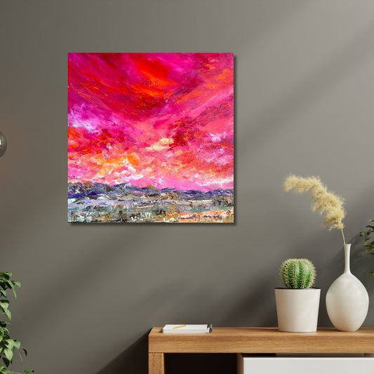 Abstract painting with vibrant colors by Ottawa artist Mireille Laroche on a wall above a wooden table with decorative items.