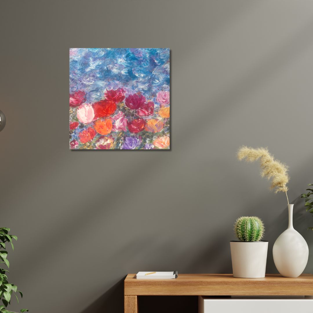 Colorful floral painting by Ottawa artist Mireille Laroche on a gray wall above a wooden table with a cactus and vase.