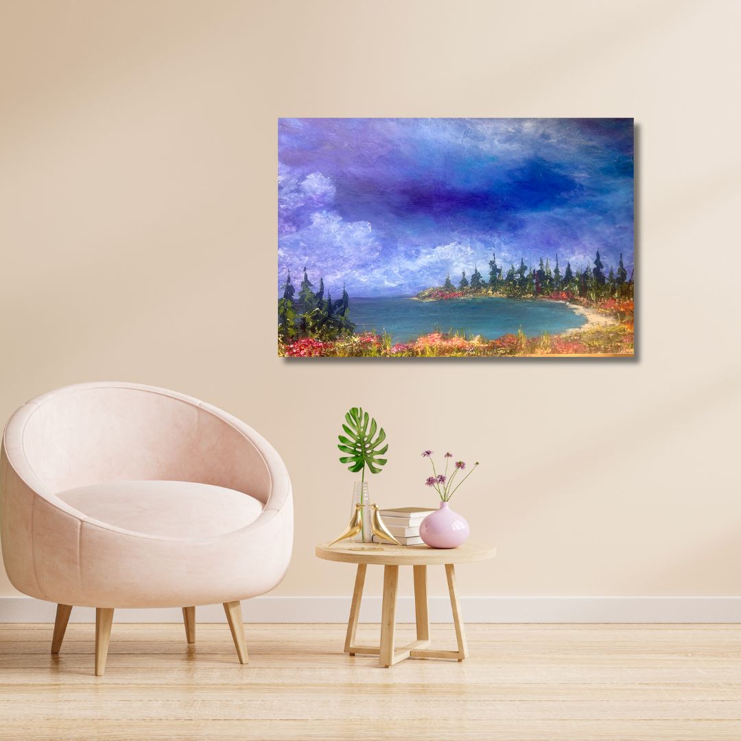Semi-abstract Landscape painting of a lake with trees and flowers by Ottawa artist Mireille Laroche  on a beige wall above a chair and small table.