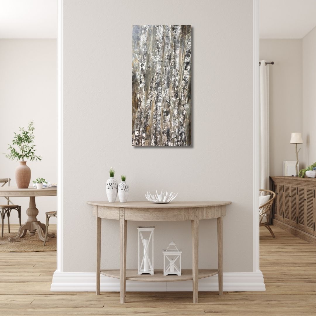 Abstract painting of birch trees in earthy tones by Ottawa artist Mireille Laroche in a modern interior with a table, decorative items