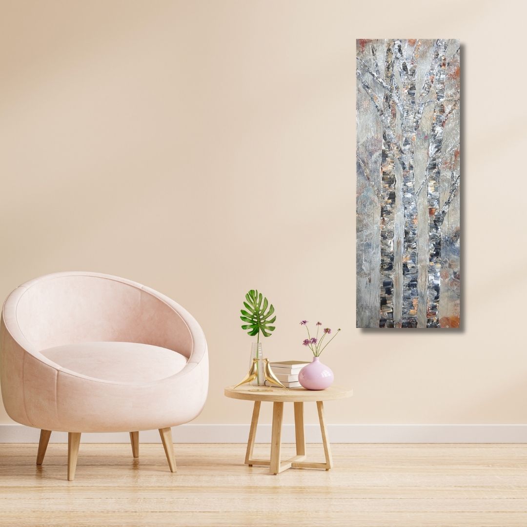Semi-abstract painting of birch trees by Ottawa artist Mireille Laroche on wall by a little table and a chair 