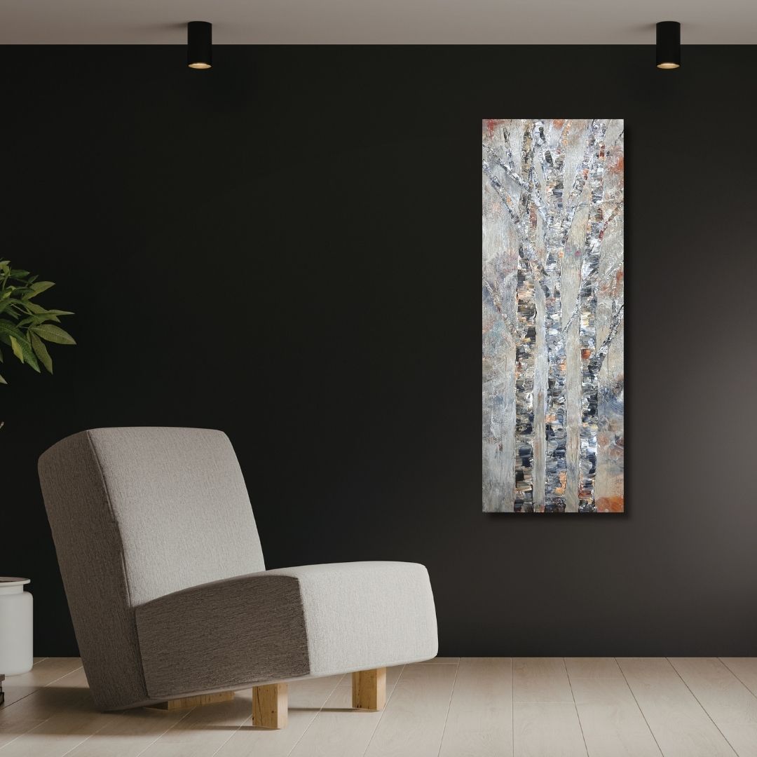 Original semi abstract painting of trees by Ottawa artist Mireille Laroche on a black wall and besides a modern chair