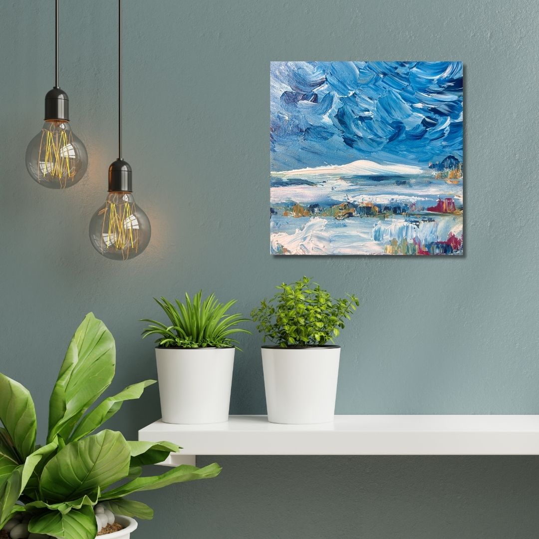 A blue abstract painting by Ottawa artist Mireille  above a shelf and plants