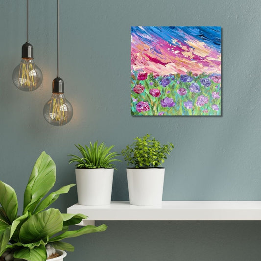 Floral painting with beautiful sunset by Ottawa artist Mireille Laroche above a shelf with plants