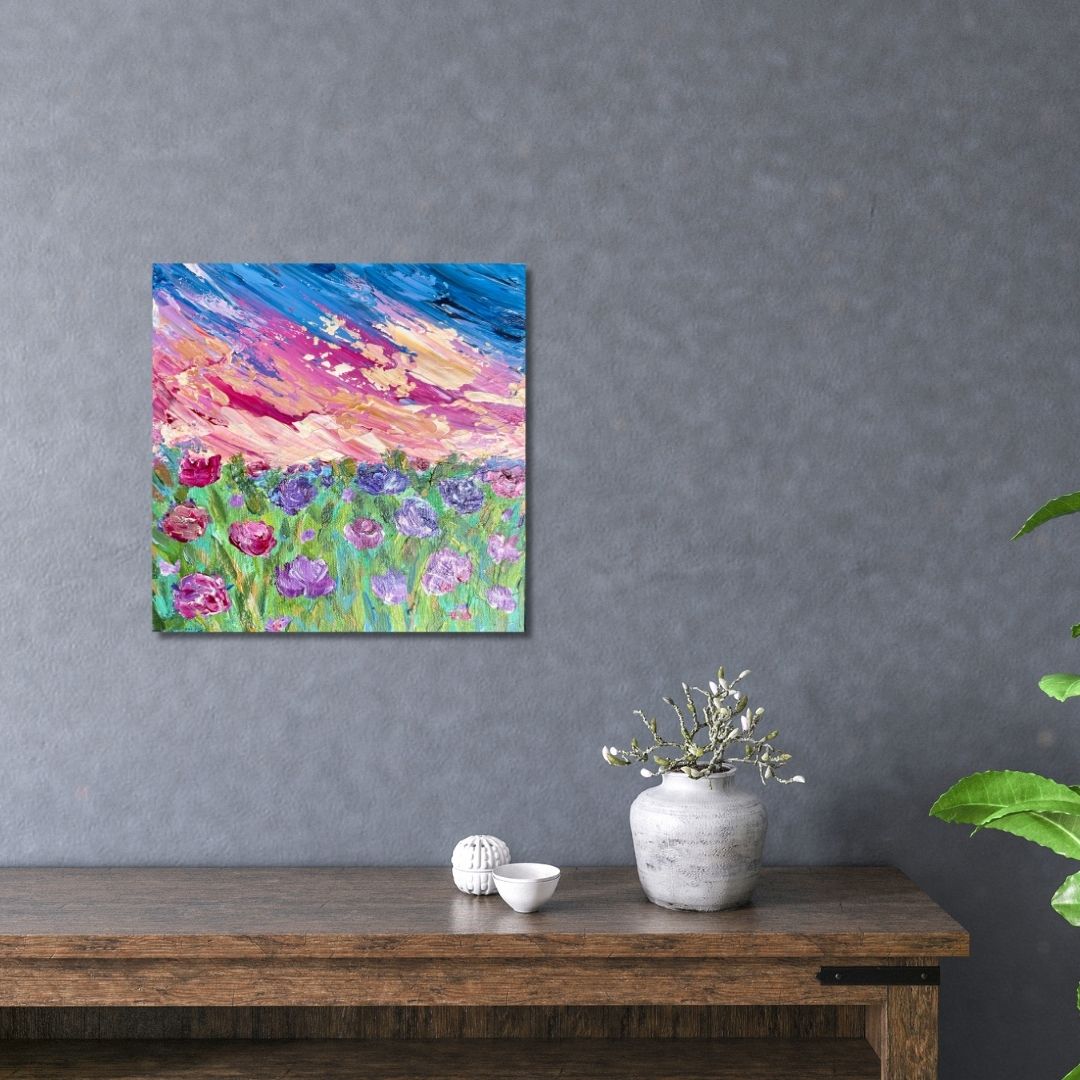 Floral painting with beautiful sunset by Ottawa artist Mireille Laroche above a table. 