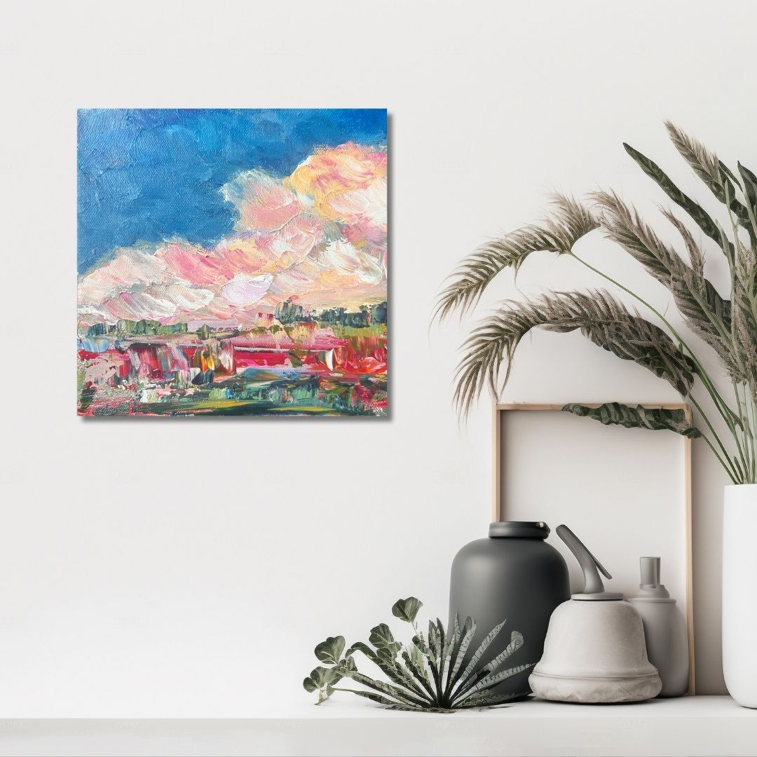 Colorful abstract painting by Ottawa artist Mireille Laroche on a wall with decorative vases and plants below.