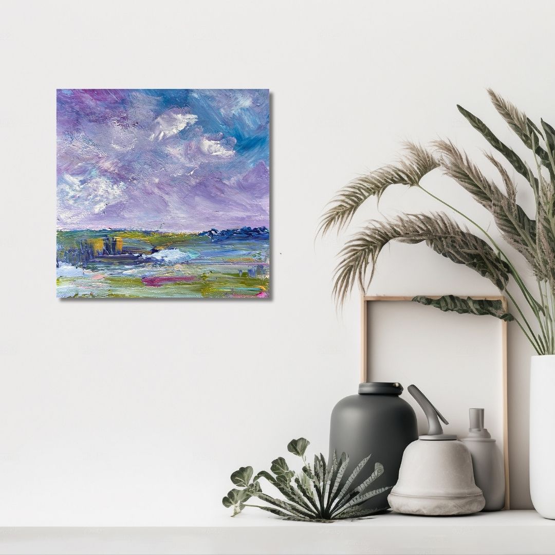 Abstract andscape painting by Ottawa artist Mireille Laroche on a wall with decorative items below