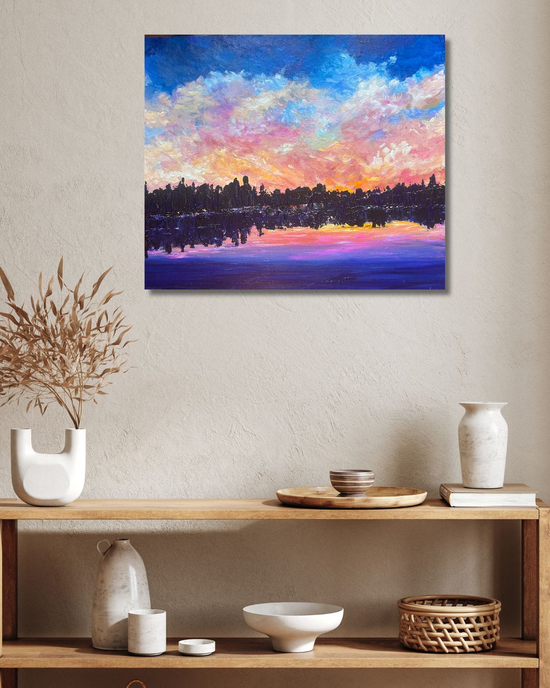 Original landscape painting by Ottawa artist Mireille Laroche on a wall above shelves 