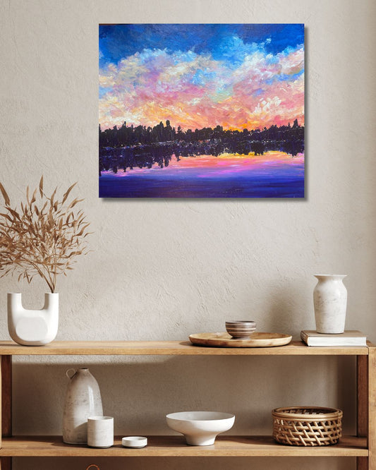 Original landscape painting by Ottawa artist Mireille Laroche on a wall above shelves 