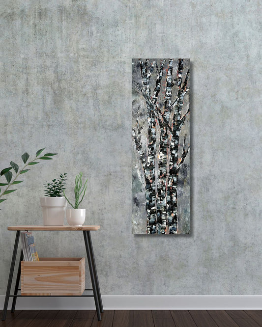 Abstract wall art piece by Ottawa artist Mireille Laroche on a textured gray wall with a small table and plants below.