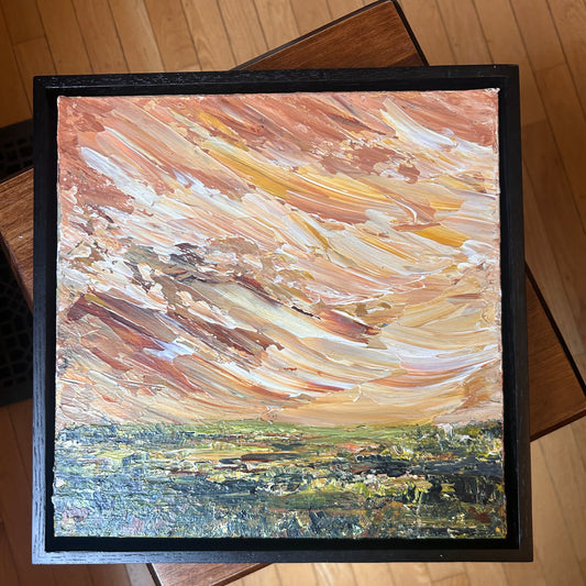 Abstract painting with floating frame by Ottawa artist Mireille Laroche with swirling colors on a wooden surface