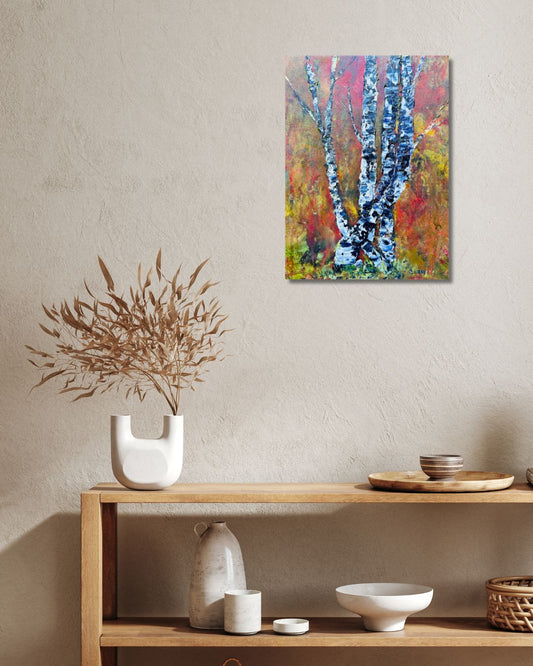 Original acrylic painting by Ottawa artist Mireille Laroche depicting trees with a fall background. Painting on a beige wall over shelve wit decorative items t. 