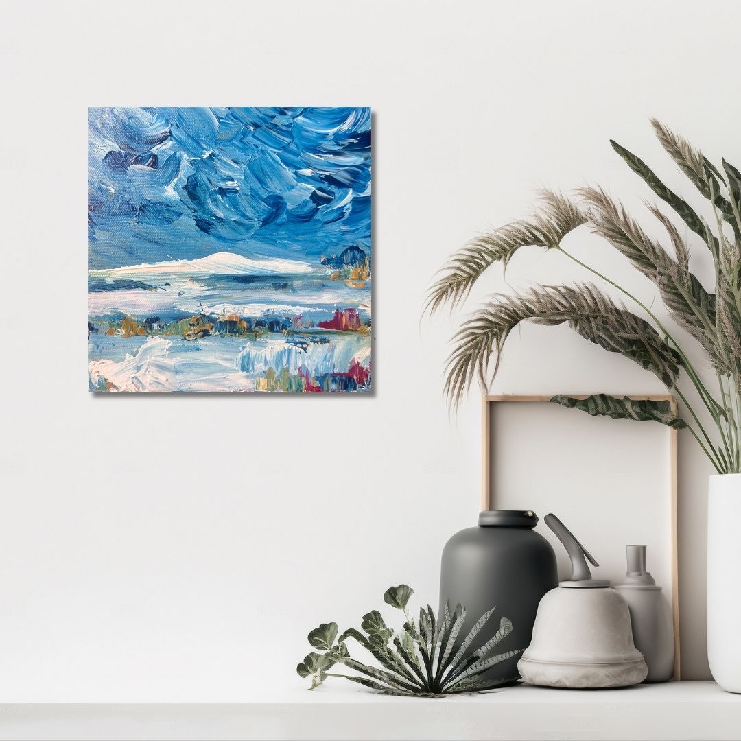 Abstract painting of a blue sky with clouds by Ottawa artist Mireille Laroche on a white wall, accompanied by decorative items.