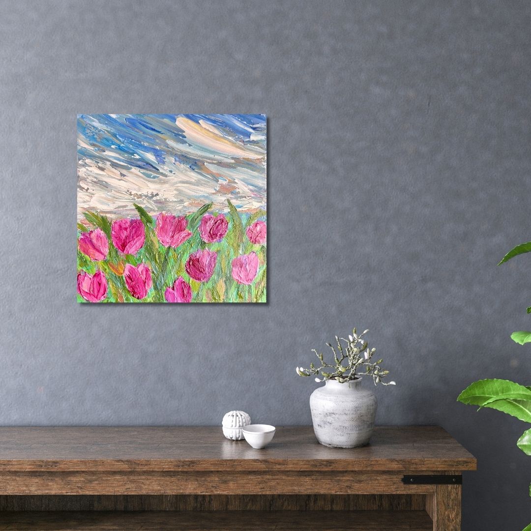 Floral painting by Ottawa artist Mireille Laroche above a table
